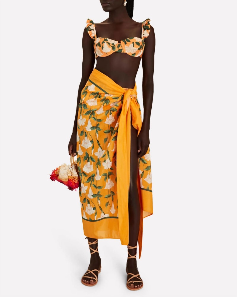 Front of a model wearing a size one-size-fits-all Alemendro Sabanero Dorado Scarf In Orange in Orange by AGUA BENDITA. | dia_product_style_image_id:351960